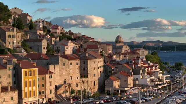 Amazing Flyby at Sunset over Sibenik, Croatia. St. James Cathedral, a UNESCO World Heritage, terracotta rooftops.