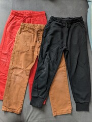 Colorful and comfortable roomy pants for an active two-year-old toddler, perfect for playtime.

