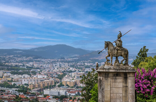 Statue of Saint Longinus at the Bom Jesus do Monte sanctuary with Braga city in the background. - Powered by Adobe