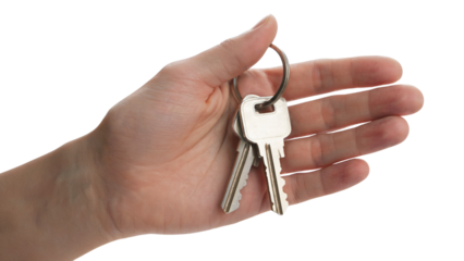 hand holding silver keys, symbolizing home and security . Isolated on transparent background, png