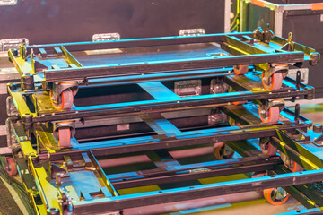 Industrial rolling platforms designed to transport heavy boxes and stage equipment throughout the venue during event setup