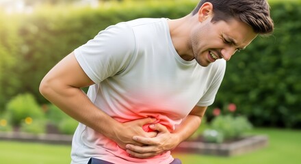 Obraz premium young man in the park in the high abdominal pain