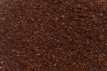 The texture of the coffee grounds is dark brown. The coffee grains appear fine to slightly coarse.