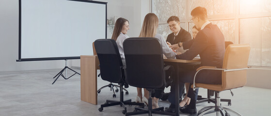 Business people negotiating at table in conference hall