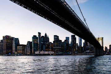 Manhattan downtown financial district across east river at sunset