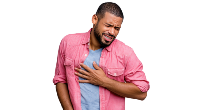 Man Experiencing Chest Pain: A man clutches his chest, depicting intense discomfort and agony, the emotional burden captured in his facial expression and posture.