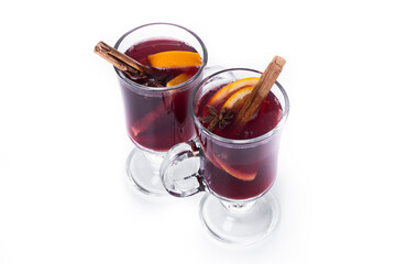 Mulled Wine with Orange and Cinnamon Sticks and Christmas decoration isolated on white background