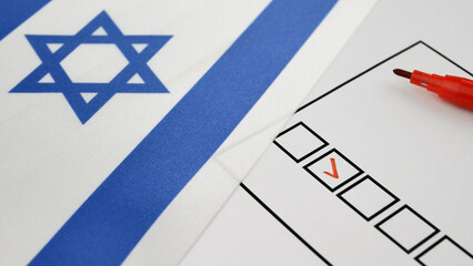 Red marker makes check next to candidates name on ballot. Israel elections. National flag with Star of David. Secure electoral system enables citizens to express political will through voting process