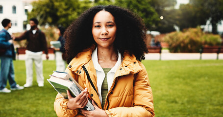 Woman, portrait and student with books in park for knowledge, education or learning in university. Female person, scholar or academic learner with smile for college scholarship or tuition in nature