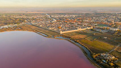 Aerial view of the medieval city of Aigues-Mortes at sunrise, in the Gard department, Occitanie region, France