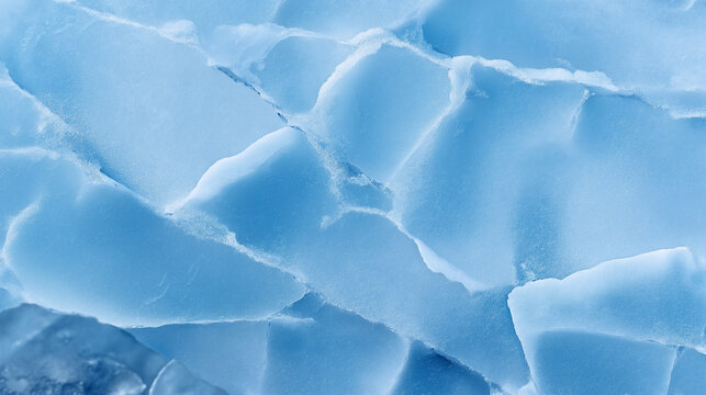 Close-up of cracked frozen ice surface with deep blue tones and natural texture.