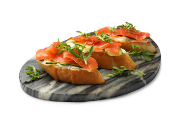 Tasty bruschettas with salmon, cream cheese, cucumber and arugula isolated on white