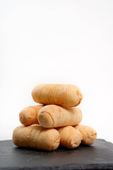 Venezuelan tequeños cheese sticks stacked on plate