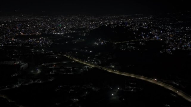 Aerial night footage of Kathmandu city during Diwali (Tihar), featuring the illuminated Dharahara Tower and glowing skyline filled with festive lights, showing Nepal&rsquo;s vibrant cultural celebration.