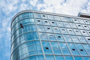 Curved Glass Facade with Window Cleaner - Urban Rope Access Scene