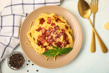 Plate with tasty pasta carbonara on white background
