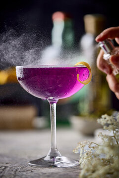 Action Close up Pink cocktail with atomizer spritz