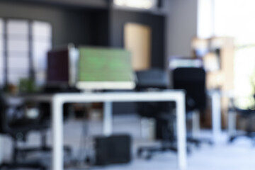 Blurred view of modern office with workplace