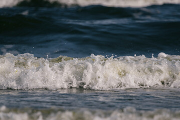 SEASCAPE - Foaming sea waves flowing towards the coast

