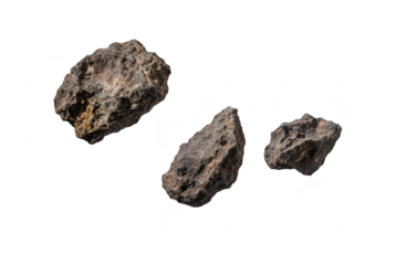 A trio of rugged. textured rocks suspended in mid-air against a clean white background. their natural formations and details. ideal for educational or decorative use