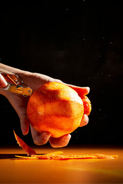 Peeling an Orange Action Shot