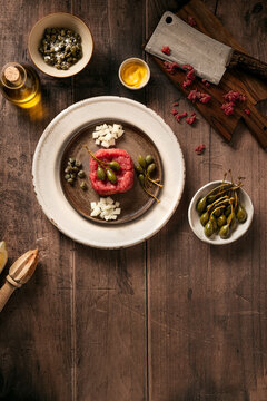 beef tartare preparation with capers and onions