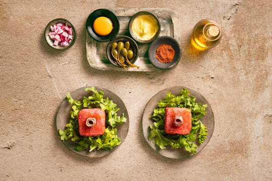 fresh tartare in plates with condiments
