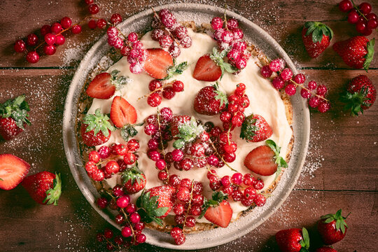 crepes with berries and whipped cream in plate