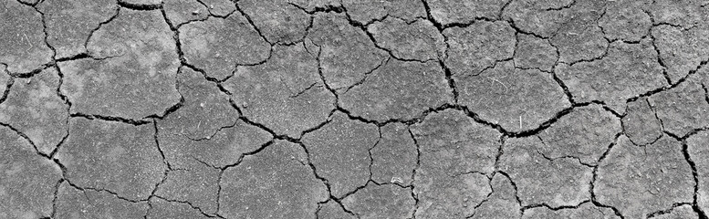 Wall texture soil dry crack pattern of drought lack of water of nature brown old broken background.