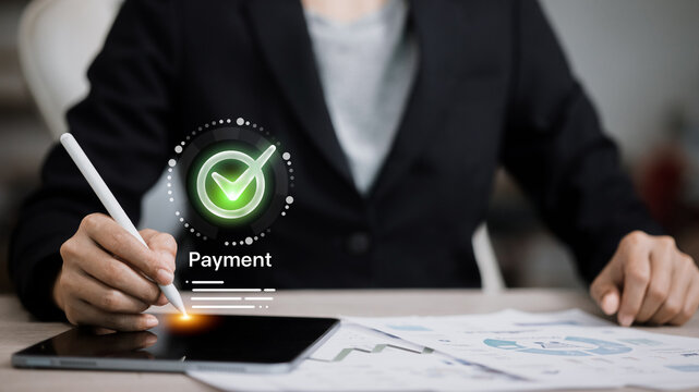 Businessman Using Stylus on Tablet for Online Payment Approval with Digital Check Mark