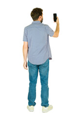 Rear view of a man holding smartphone taking selfie on white background