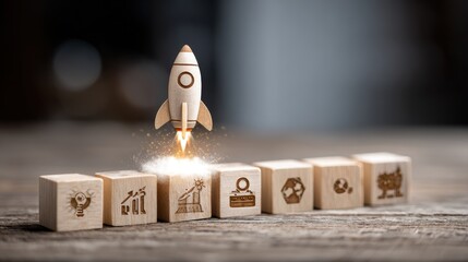 Rocket launching from wood cube with business icon, Start-up, Creativity, Big idea, Business goals management, Investment on new project to wealth, Company strategy target, Sustainable financial plan