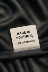 Clothing Label with Textile Care Instructions Tags: High-Quality Silk Fabric, Sustainable Fashion, and Manufacturing Origin in Portugal