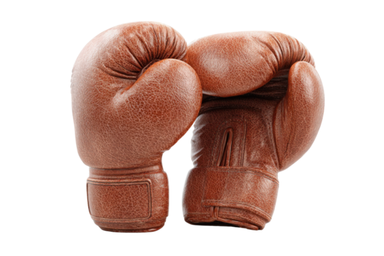 Boxing Gloves: Vintage leather boxing gloves, weathered and worn, rest together, ready for a match, embodying the grit and determination of the sport.