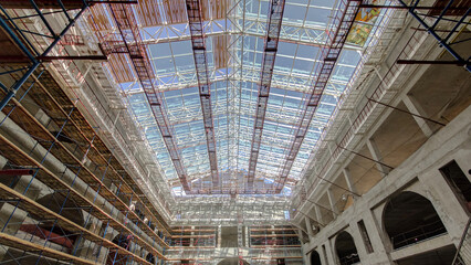 Construction equipment material with scaffolding and tools inside the floor of high rising building...