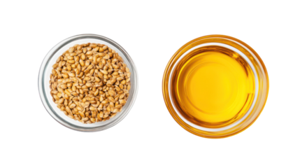 Kernel seeds and kernel oil in a glass bowl overhead side by side on transparent background