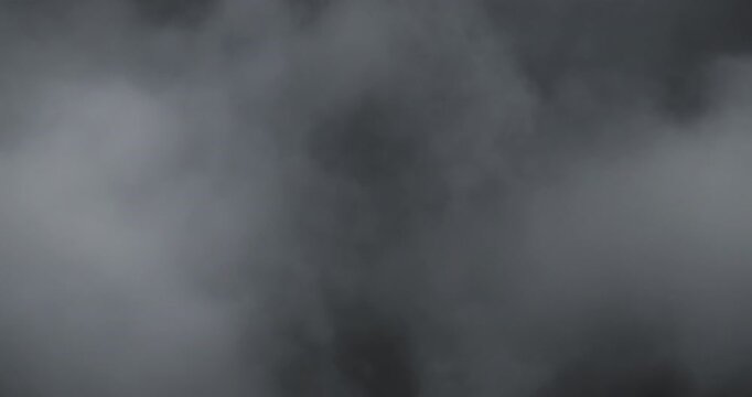 Artistic ethereal 4K slow-motion footage of swirling fog and soft drifting smoke clouds, evoking tranquil mystery, cinematic ambience, delicate vapor movement, and moody brume ideal for visual design.