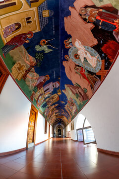 Cyprus - July 22 2018: Arched corridor with ceiling murals in Kykkos Monastery