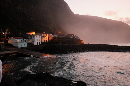 Serene seaside village illuminated by gentle dusky glow