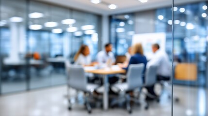 Fototapeta premium Blurred background of a business meeting in a modern glass conference room