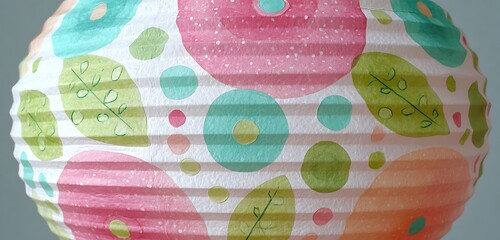 patterned paper lantern with painted flowers, leaf motif, polka dots with spring charm.