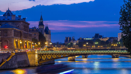 Le Pont D'Arcole bridge after sunset with boats day to night timelapse, Paris, France, Europe
