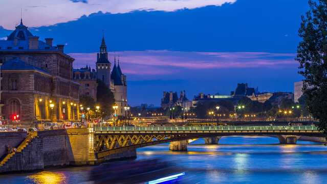 Le Pont D'Arcole bridge after sunset with boats day to night timelapse, Paris, France, Europe