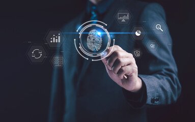 Businessman touching digital fingerprint scan for cybersecurity, artificial intelligence, and data...