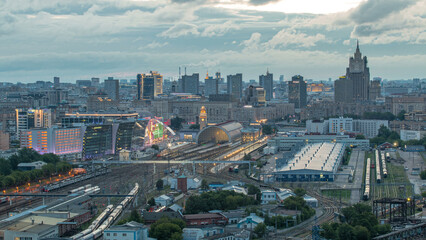 Fototapeta premium Panoramic view to Kiev Railway Station night to day timelapse and modern city in Moscow, Russia