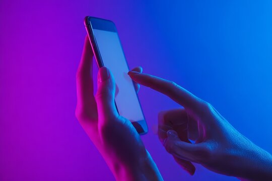 Woman s finger interacting with mobile app in a room illuminated by blue and purple neon lights - Powered by Adobe