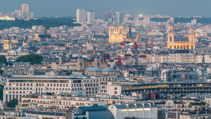 Aerial panorama above houses rooftops in a Paris day to night timelapse