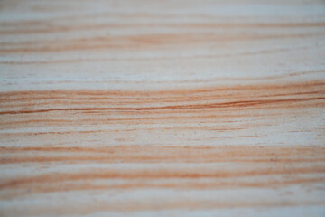 Detailed close-up of a light wooden surface showing natural grain patterns and subtle color...