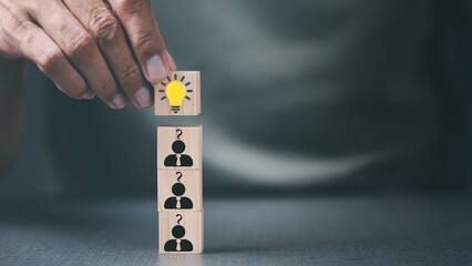 Business people hold on to wooden blocks, business innovation ideas and creativity from inventions, technological developments from inspiration and connecting ideas and imagination to success.