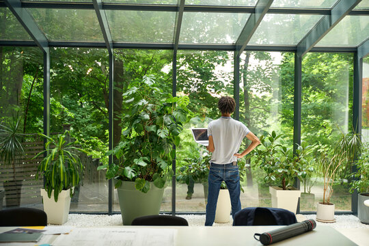 Caucasian man standing confidently in coworking area